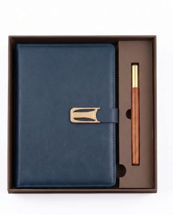Blue leather wallet with a gold clasp in a brown gift box, alongside a matching wooden pen with a gold tip.