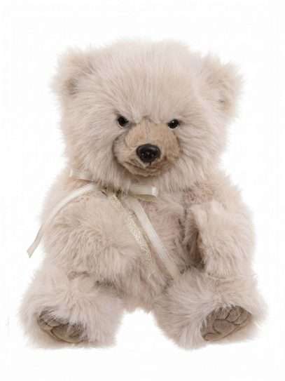 Cream-colored plush teddy bear with a beige ribbon bow around its neck, facing forward against a white background.