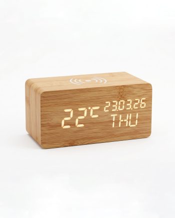 Wooden digital clock showing 22°C, 23:03:26 and THU, with a wireless charging indicator on top.