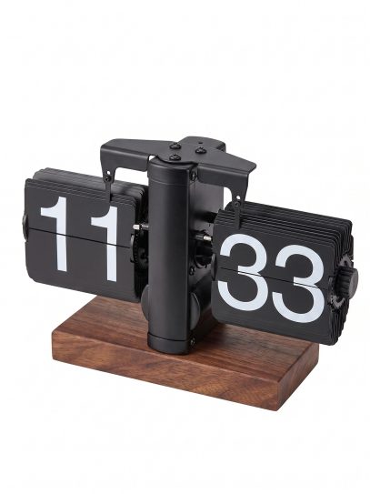 Flip-style clock with black panels displaying 11 on the left and 33 on the right mounted on a metal frame with a wooden base.