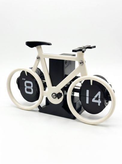 White bicycle-shaped desk clock with black spoke wheels displaying 08:14.