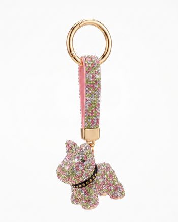 Rose-gold keyring with a pink crystal-encrusted strap, attached to a jeweled dog charm as the focal accessory.