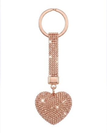 Rose-gold keychain with a crystal-encrusted heart charm hanging from a beaded strap.