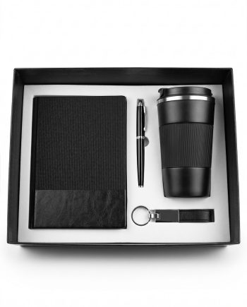 Gift set in a black box including a textured black notebook, a sleek pen, a black travel mug, and a keychain USB drive.