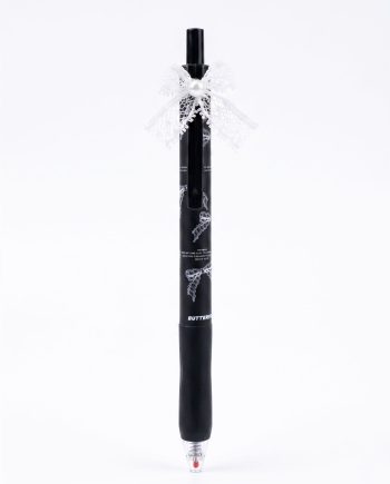 Black ballpoint pen decorated with a white lace bow and pearl accent, standing upright against a white background.