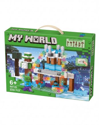 Box for a Minecraft-style building set in green packaging, showing a snowy landscape with a brick-built arch, trees, and a small blue structure; includes a minifigure in blue clothing on the left.