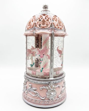 Ornate pink and silver carousel lantern with glass panels and miniature unicorns inside, on a decorative base.