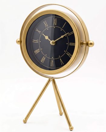 Gold-tone round clock with a black Roman-numeral face mounted on a tripod-style stand