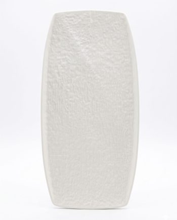 Tall white ceramic vase with a rough, textured surface standing upright against a clean white background.