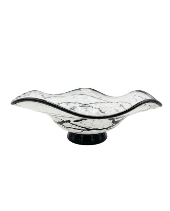 Decorative blown glass bowl with a black rim and white floral marbling on a black pedestal base.
