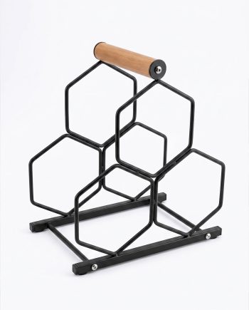 Modular black metal hexagon rack with a cylindrical wooden bar on top, resting on a flat metal base—an abstract storage or display stand.