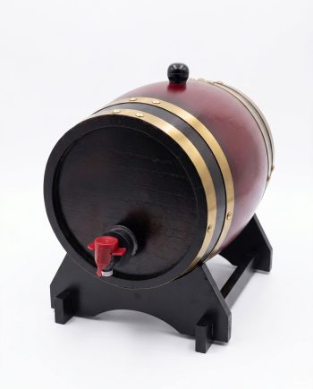Small wooden barrel on a black wooden stand with gold bands and a red tap, likely a decorative mini keg for dispensing liquids